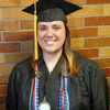 Phi Alpha Theta member Kensie Zills waits in the area assigned to students in the College of Education and Human Studies prior to Union University's spring graduation at the Oman Arena on May 16, 2015.