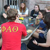 History students enjoy food and fellowship at the History Welcome Reception on August 29, 2016. They are: (starting on the left and going clockwise) Nic Linn (wearing gray shirt), Leah Atkins, Brianna Hammond, Kathryn Mitchell, Susannah Murphine, Katie Allison, Priscilla Porter, Thomas Gray, and Allison Pulliam.