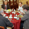 Guests at the Carls-Schwerdfeger history dinner in honor of Dr. Sean McMeekin enjoy food and conversation together. They are (starting on the left, going clockwise) Dr. James Patterson, Dr. David Thomas, Seth Reid, Professor Roger Stanley, and Dr. Terry Lindley (back to camera).