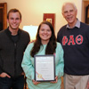 Delta-Psi Chapter President Jordan Sellers holds the 2016 Phi Alpha Theta Best Chapter Award at the chapter's celebratory pizza party on October 21, 2016. With her are Delta-Psi Secretary Seth Reid (left) and Faculty Advisor Dr. Stephen Carls.