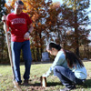 Dr. Keith Bates and Katherine Cheshire straighten a small tombstone at Salem Cemetery as a part of a Phi Alpha Theta community serice project on November 1, 2016. Photo by Elizabeth Wilson