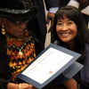 Many-Bears Grinder (right), the Tennessee Department of Veterans Services Commissioner, presents a certificate of appreciation to Mrs. Katie Cobb, one of the few remaining widows of World War I veterans living in the United States, during a World War I commemoration program that the Tennessee Great War Commission sponsored at the First Presbyterian Church in Jackson on November 4, 2016.