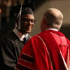 History major Byron Elam accepts congratulations on his successful completion of a bachelor of arts program at Union University from President Dr. Samuel W. "Dub" Oliver at the school's fall commencement services on December 17, 2016. Photo by Kristi Woody