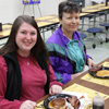 Kathryn Mitchell (left) and Dr. Alice-Catherine Carls enjoy breakfast at the Jackson Old Hickory Rotary Club Pancake Breakfast on March 18, 2017.