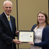 Dr. Stephen Carls gives a certificate of appreciation to Kathryn Mitchell at the history awards banquet on May 4, 2017, for her work as the 2016-2017 vice president of the Delta-Psi chapter of Phi Alpha Theta History Honor Society. Photo by Janelle Vest
