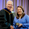 Phi Alpha Theta member Emily Littleton accepts the Academic Excellence Medal in History from Dr. Stephen Carls at the Union University Awards Day Convocation on May 5, 2017. Photo by Kristi Woody