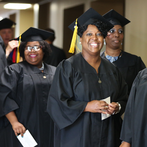 Social work graduates (from left) Jessica Morton, Janice Kelley and Stephanie McKissick Johnson prepare for the processional at Union's July 29 commencement ceremony. (Photo by Kristi Woody)