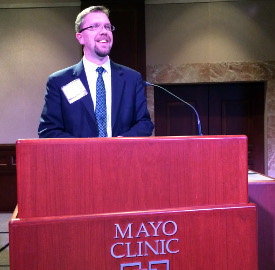 Justin Barnard speaks at Mayo Clinic in Rochester, Minnesota, about technology assessment.