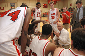 Union University men's basketball coach Ralph Turner talks to his team during a timeout in a recent game. The Bulldogs are ranked atop the NAIA for the first time in school history. (Photo by Brad Moore)