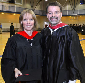 Karen and Keith Singer prepare for the graduation ceremony Dec. 15 where they each received graduate degrees from Union University. (Photo by Morris Abernathy) 