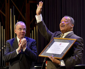 Fred Luter (right) thanks students at Union after his induction into the R.G. Lee Society of Fellows, while Union President David S. Dockery applauds him. (Photo by Morris Abernathy) 