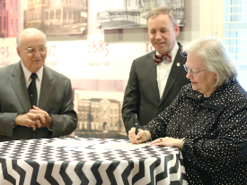 Lynne Murchison signs papers establishing a scholarship fund in memory of her brother Tom. Also pictured are Union President Samuel W. "Dub" Oliver (center) and Bob Agee, Union's vice president for institutional advancement (left). (Photo by Kristi Woody)