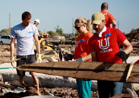 Union staff members Lee Wilson (right) and Tim Call (left), along with 2013 Union graduate Cassie Osborn (center), help with cleanup efforts in Moore, Okla. (Photo by Sarah Belcher)