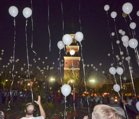 Participants at last year's "Remember Me" walk release balloons to honor loved ones they had lost to homicide. (Photo by Morris Abernathy)