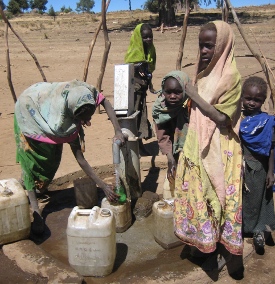 Sudanese villagers draw water from the well that Joshua Guthrie's "Dollar for a Drink" campaign funded.