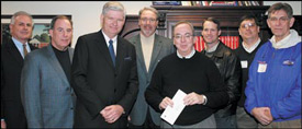 Presenting the check on Feb. 13 to David Dockery, president of Union University, who holds the check, are, from left, Dwyte Winningham, Tennessee Baptist Children's Homes; Gary Coltharp, Tennessee Baptist Foundation; Mickey Basham, president, Tennessee Baptist Convention Executive Board; Chuck Groover, chairman of the Administrative Committee of the Executive Board; Dockery; Tom McCoy, TBC president; William Maxwell, TBC staff; and Walter Grubb, president, Harrison-Chilhowee Baptist Academy, Seymour.