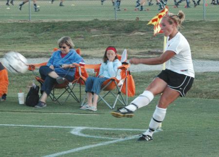 Caitlin Zimmerman sends a corner kick towards her teammates. - Photo by Tommy Sadler