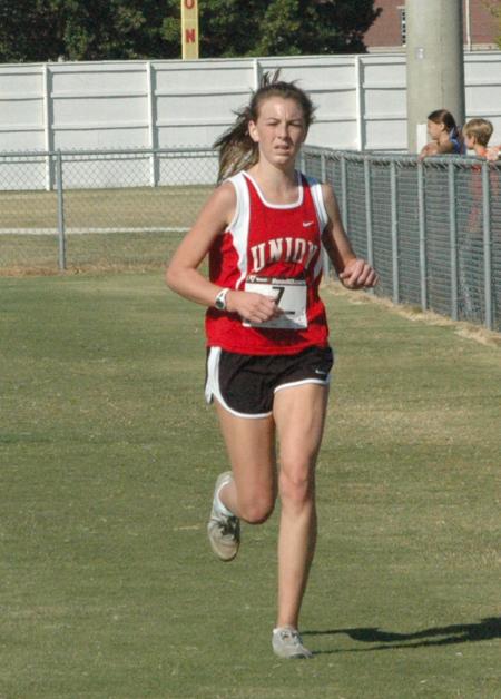 Charley Moss finishes the Union University Cross Country Invitational. - Photo by Tommy Sadler