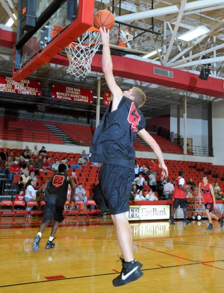 Freshman Luke Allison makes a layup during warm ups before Bulldog Madness. - Photo by Morris Abernathy