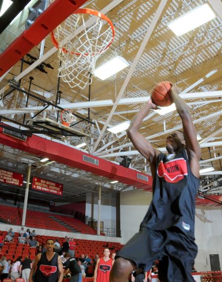 Junior guard Antoine Joseph goes up for a dunk during warm ups at Bulldog Madness. - Photo by Morris Abernathy