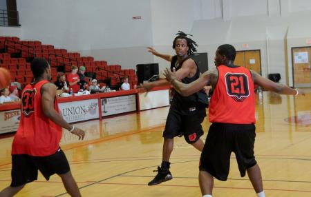 Junior guard Tacuma Alexander passes to a teammate during the Bulldog Madness. - Photo by Morris Abernathy