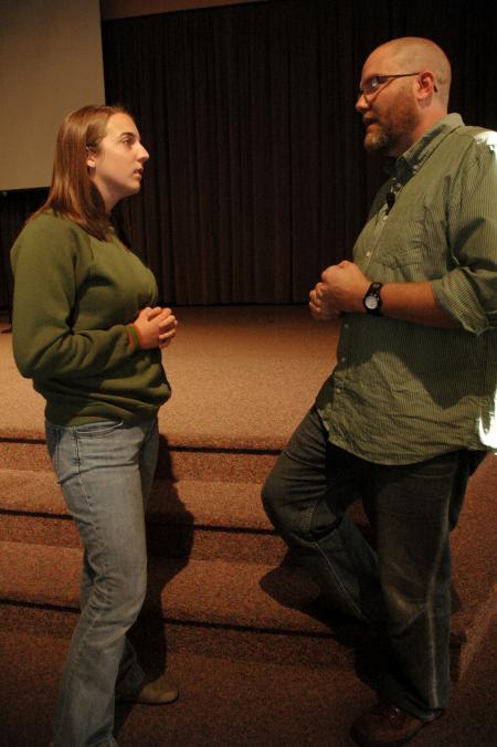 Senior psychology major Amanda Hamilton talks with Russ Pflasterer after he spoke in chapel concerning Christ-like use of economics.  - Photo by Beth Spain