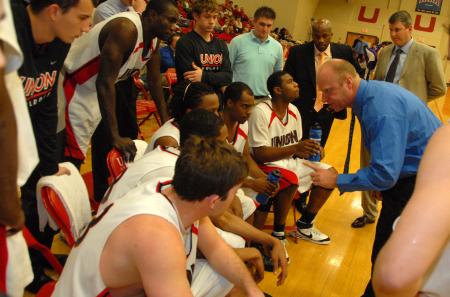 Head coach Ralph Turner gives instructions to his players during a time out. - Photo by Morris Abernathy