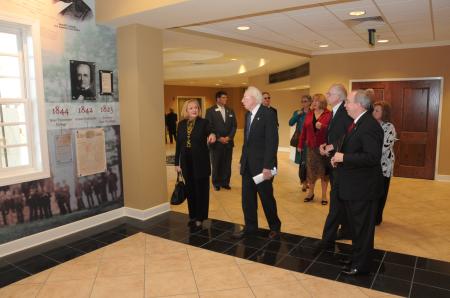 President Dockery gives the Grants a tour of the Heritage Center prior to the dedication of the Grant Events Center. - Photo by Morris Abernathy