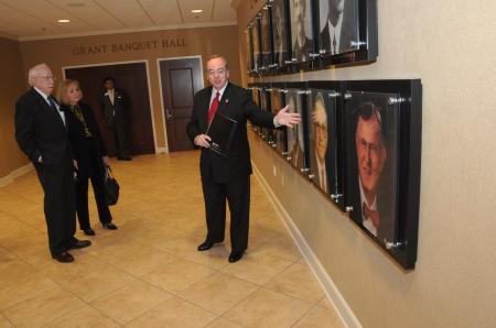 President Dockery talks about Union's former presidents to the Grants in the Hall of Presidents. - Photo by Morris Abernathy
