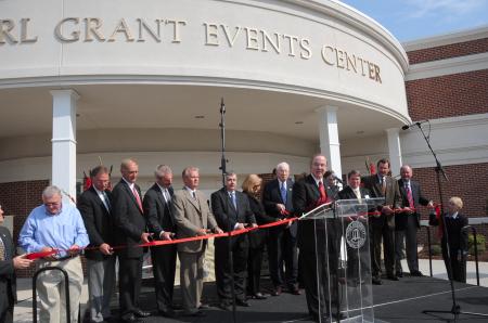 Individuals instrumental in the construction of the Grant Events Center prepare for the ribbon cutting. - Photo by Morris Abernathy