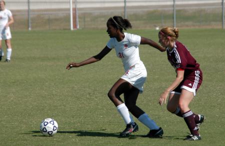 Eboni Murphy (31) dribbles the ball away from the defender. - Photo by Steven Aldridge