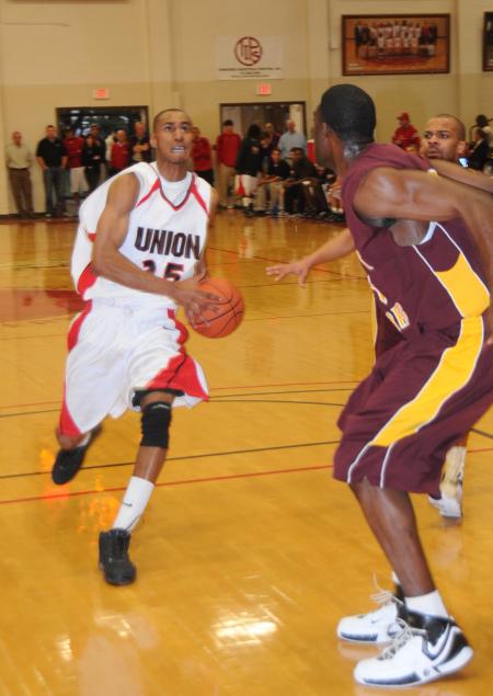 Junior Keith Tolliver drives to the basket in the Bulldog's Homecoming win over Robert Morris (Ill.) College. - Photo by Morris Abernathy