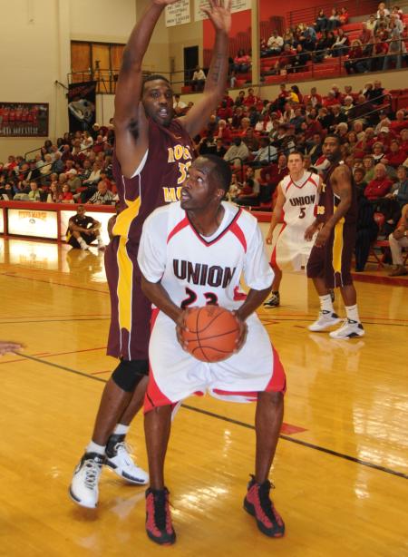 Greg Truvillion, junior, prepares to take a shot in Union's Homecoming game versus Robert Morris (Ill.) College. - Photo by Morris Abernathy