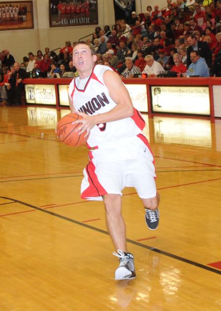 Junior guard Alan North drives to the basket. - Photo by Morris Abernathy