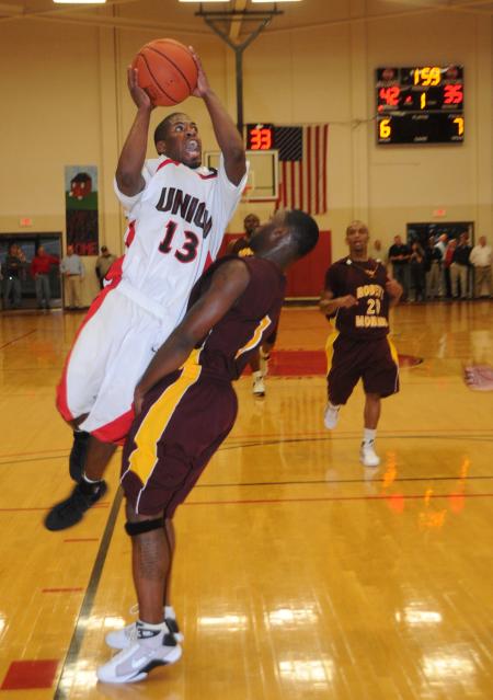 Martez Hawkins, junior, shoots over a defender from Robert Morris (Ill.) College in Union's Homecoming win. - Photo by Morris Abernathy