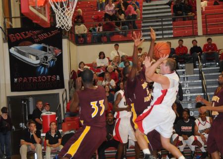 Matt Neaville, senior guard, drives past defenders to score in the Bulldog's Homecoming win over Robert Morris (Ill.) College. - Photo by Morris Abernathy