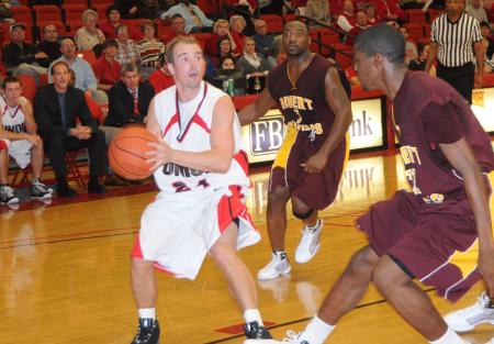 Senior guard Matt Neaville prepares to take a shot over a defender in Union's Homecoming victory over Robert Morris (Ill.) College. - Photo by Morris Abernathy