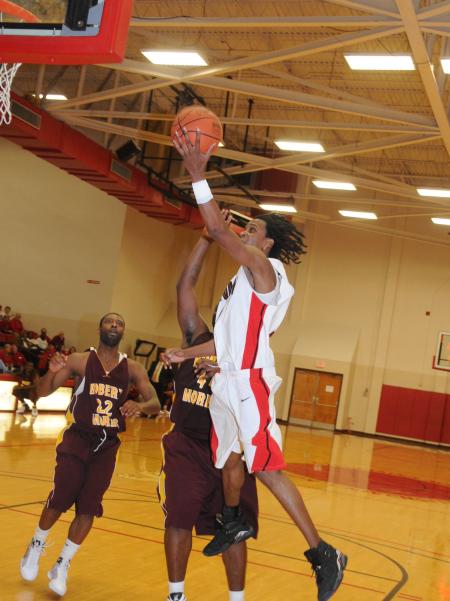 Junior guard Tacuma Alexander makes a shot during Union's Homecoming win over Robert Morris (Ill.) College. - Photo by Morris Abernathy