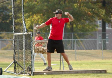 Union baseball assistant coach, Joseph Talley, tosses batting practice. - Photo by Steven Aldridge