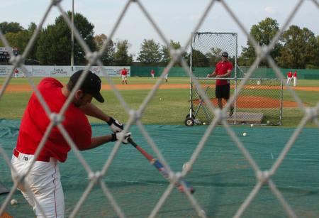 Allen Williams takes his cuts during batting practice with Assistant Coach Joseph Talley pitching. - Photo by Steven Aldridge