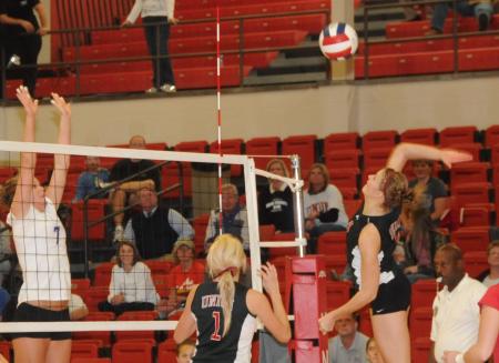 Ashley Young goes up for the hit as Katie Adams looks on during the championship match of the TranSouth Conference Tournament. - Photo by Morris Abernathy