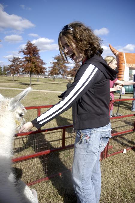Junior Celeste Edworthy feeds an Emu during Arts in the Park. - Photo by Beth Spain