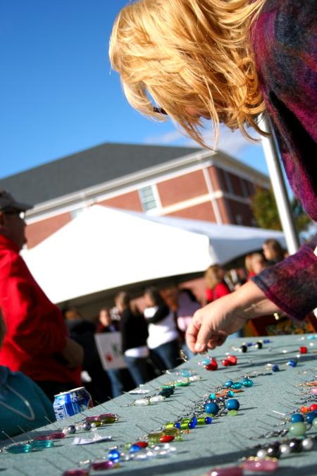 Several alumni and students sold their handmade crafts at Arts in the Park. - Photo by Kristi McMurry Woody