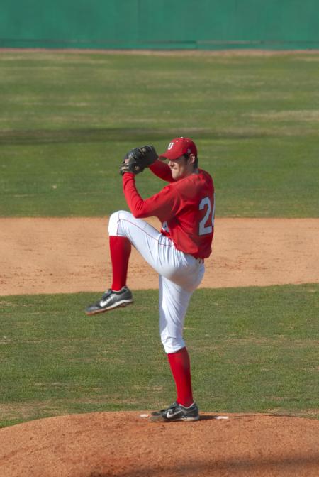 Senior Ben Ayris prepares to throw a pitch. - Photo by Morris Abernathy