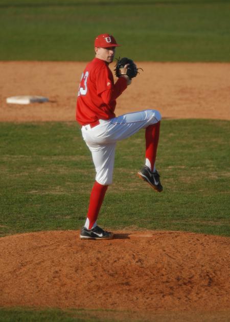 Senior pitcher Josh Holman prepares to throw to the plate. - Photo by Morris Abernathy