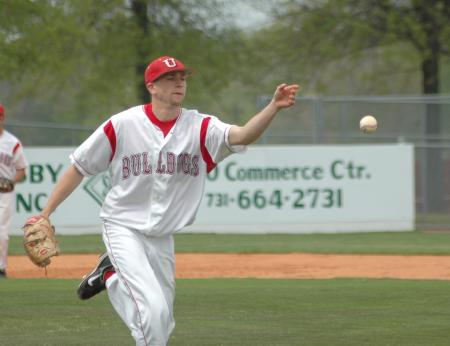 Senior pitcher Josh Holman fields a bunt and tosses the ball to first for the out. - Photo by Morris Abernathy
