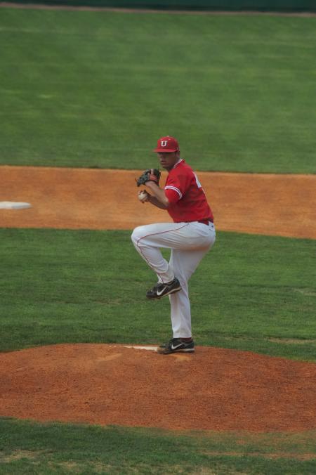 Junior pitcher Danny Alberty begins to throw the ball to the plate. - Photo by Morris Abernathy