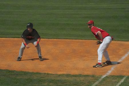 Freshman Kevin Kirksey holds the runner at first. - Photo by Morris Abernathy