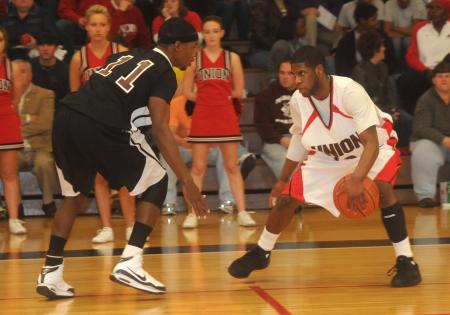 Junior guard Martez Hawkins gets around a defender. - Photo by Morris Abernathy