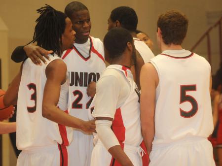 Union Bulldogs huddle prior to a free throw attempt. - Photo by Morris Abernathy